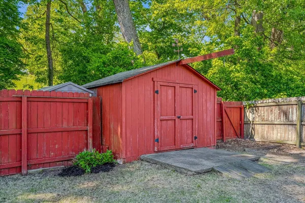 a view of barn with a small yard
