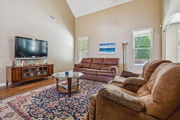 a living room with furniture and a flat screen tv