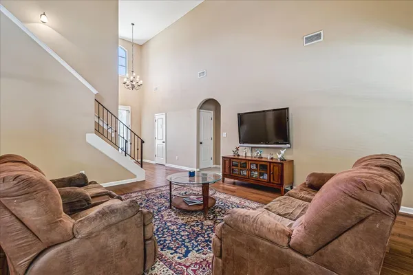 a living room with furniture and a flat screen tv