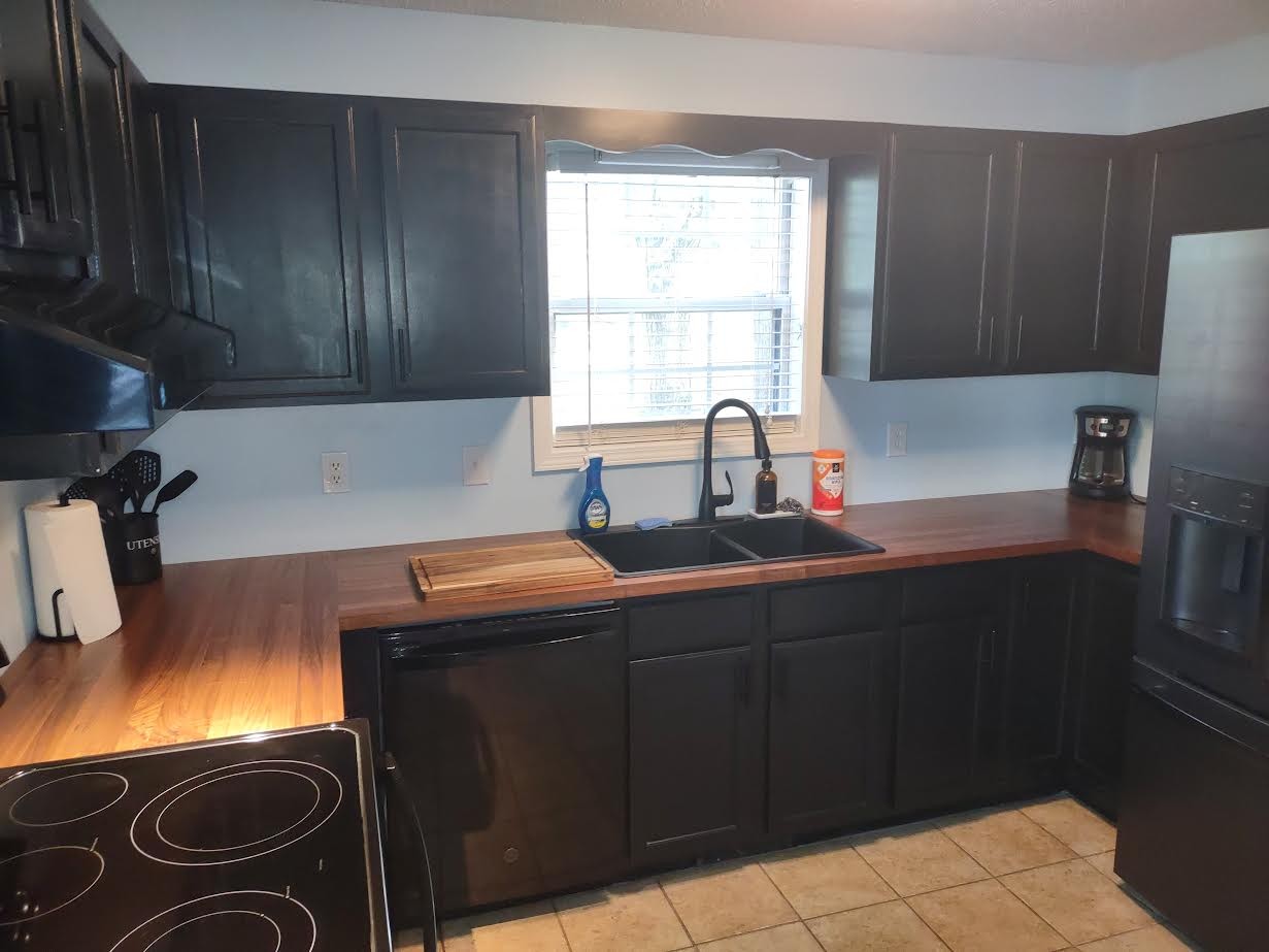 3300 Backridge Road Woodlawn, TN 37191 - Photo 13 of 42 a kitchen with a sink stove and cabinets