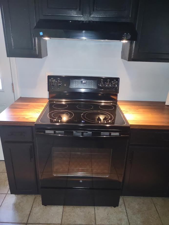 3300 Backridge Road Woodlawn, TN 37191 - Photo 14 of 42 a stove top oven sitting inside of a kitchen