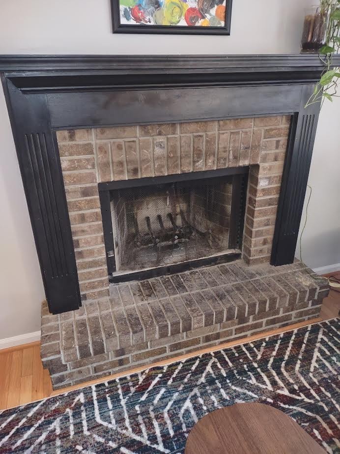 3300 Backridge Road Woodlawn, TN 37191 - Photo 18 of 42 a fireplace with a clock on top of it