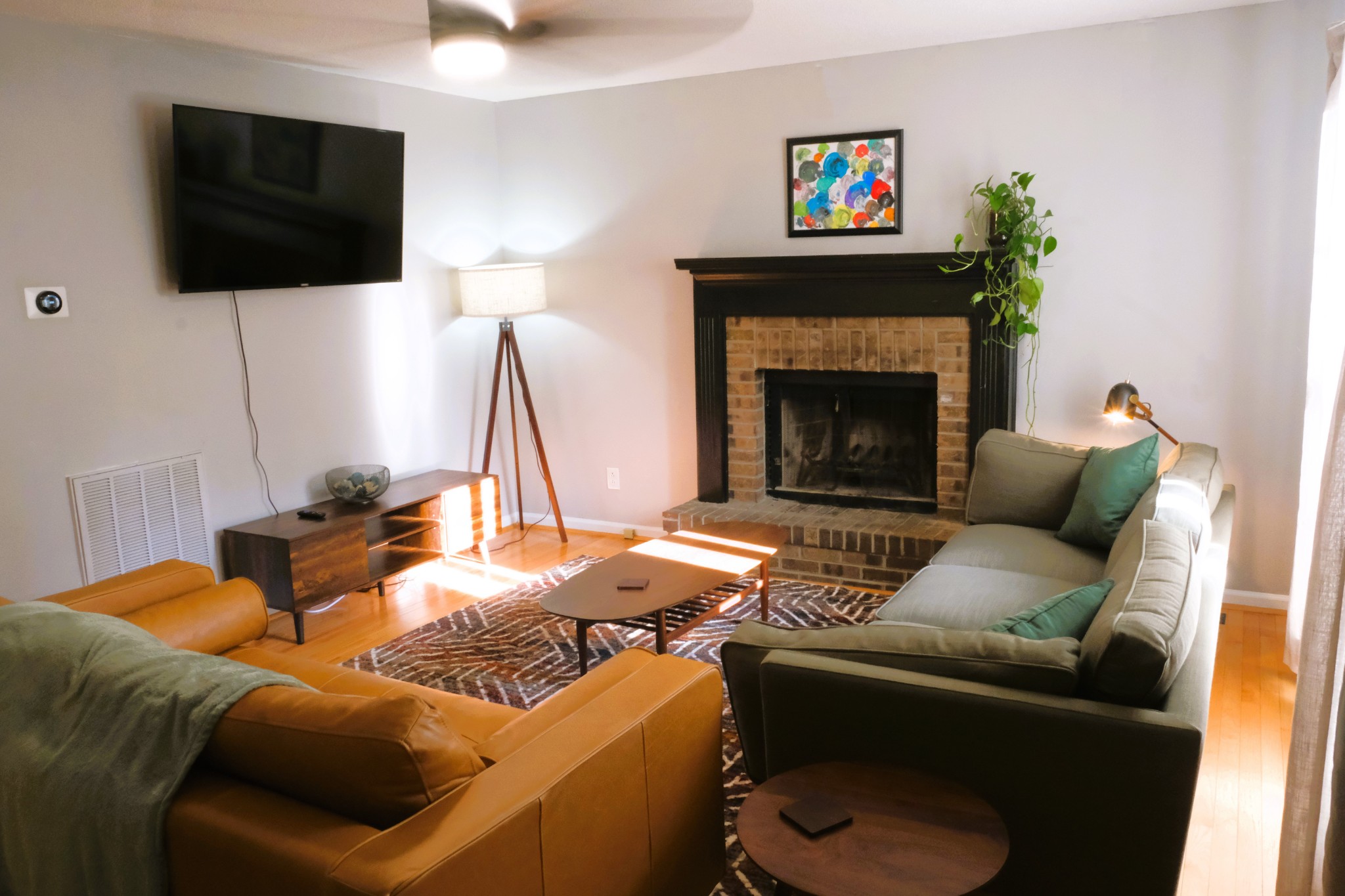 3300 Backridge Road Woodlawn, TN 37191 - Photo 20 of 42 a living room with furniture a flat screen tv and a fireplace