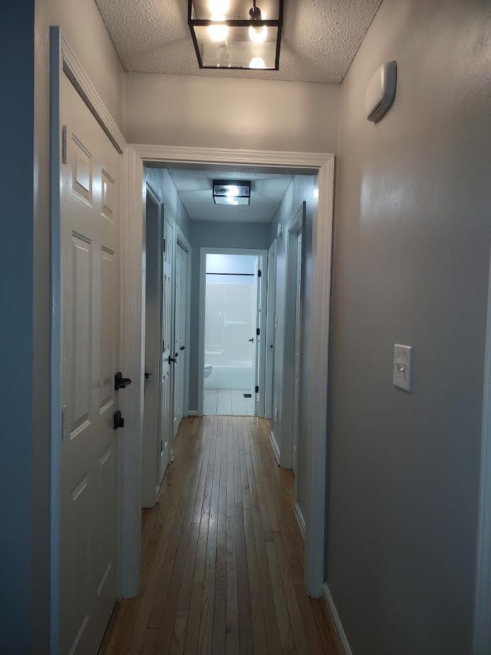 3300 Backridge Road Woodlawn, TN 37191 - Photo 23 of 42 a view of a hallway with wooden floor