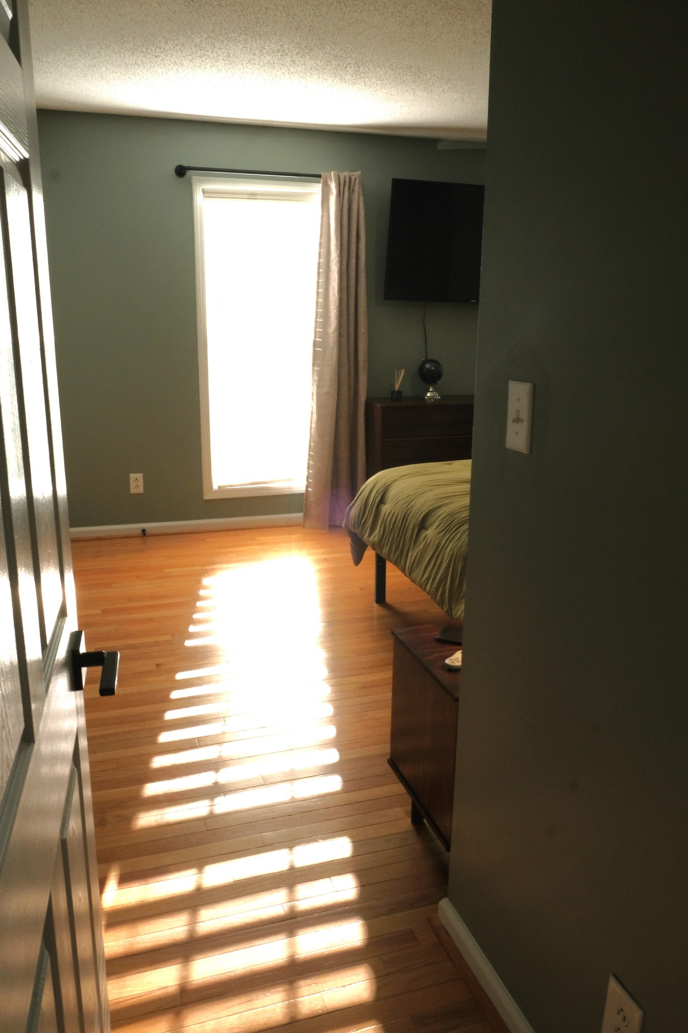 3300 Backridge Road Woodlawn, TN 37191 - Photo 27 of 42 a bedroom with a bed and a flat screen tv