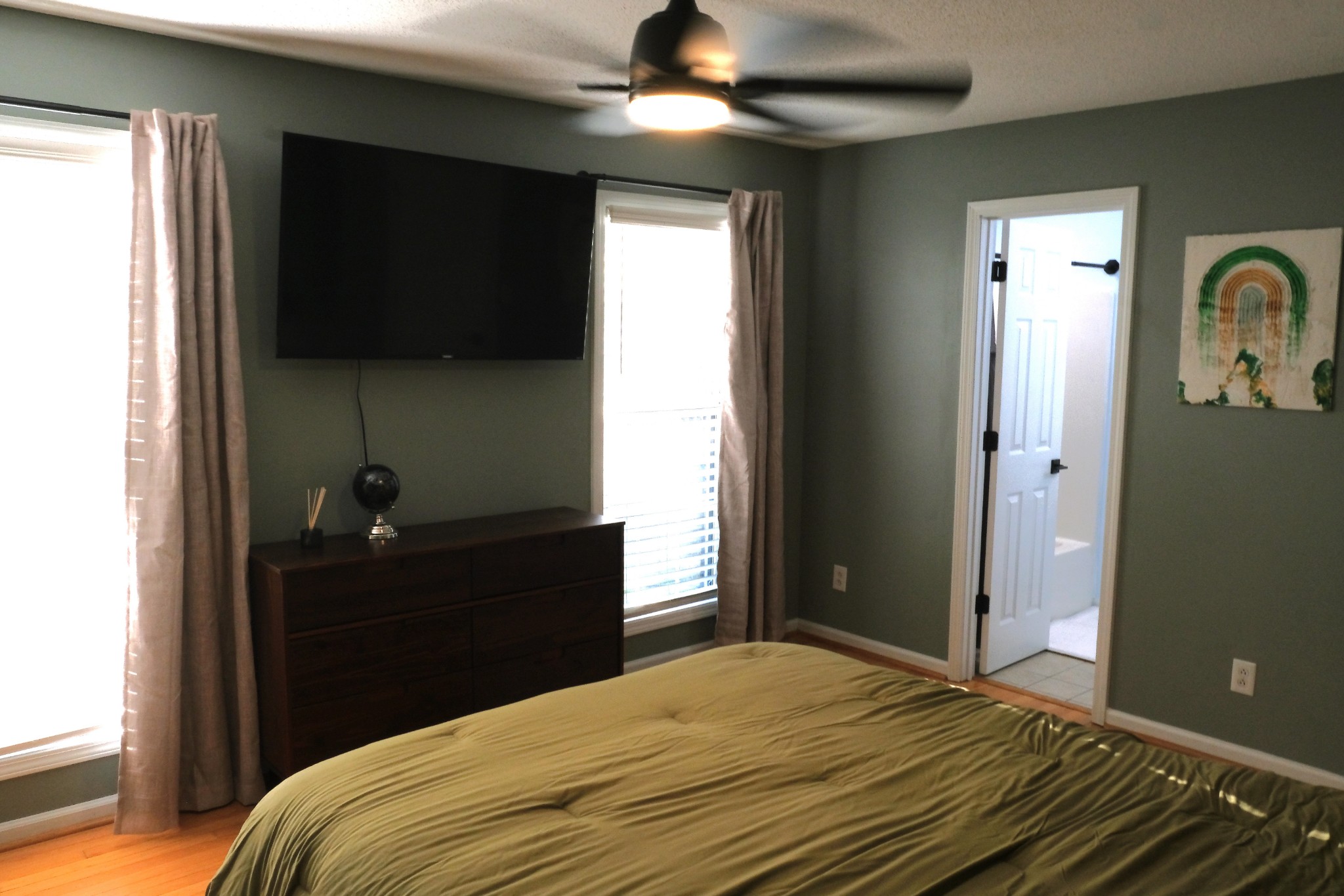 3300 Backridge Road Woodlawn, TN 37191 - Photo 30 of 42 a bedroom with a bed and a flat tv screen on dresser