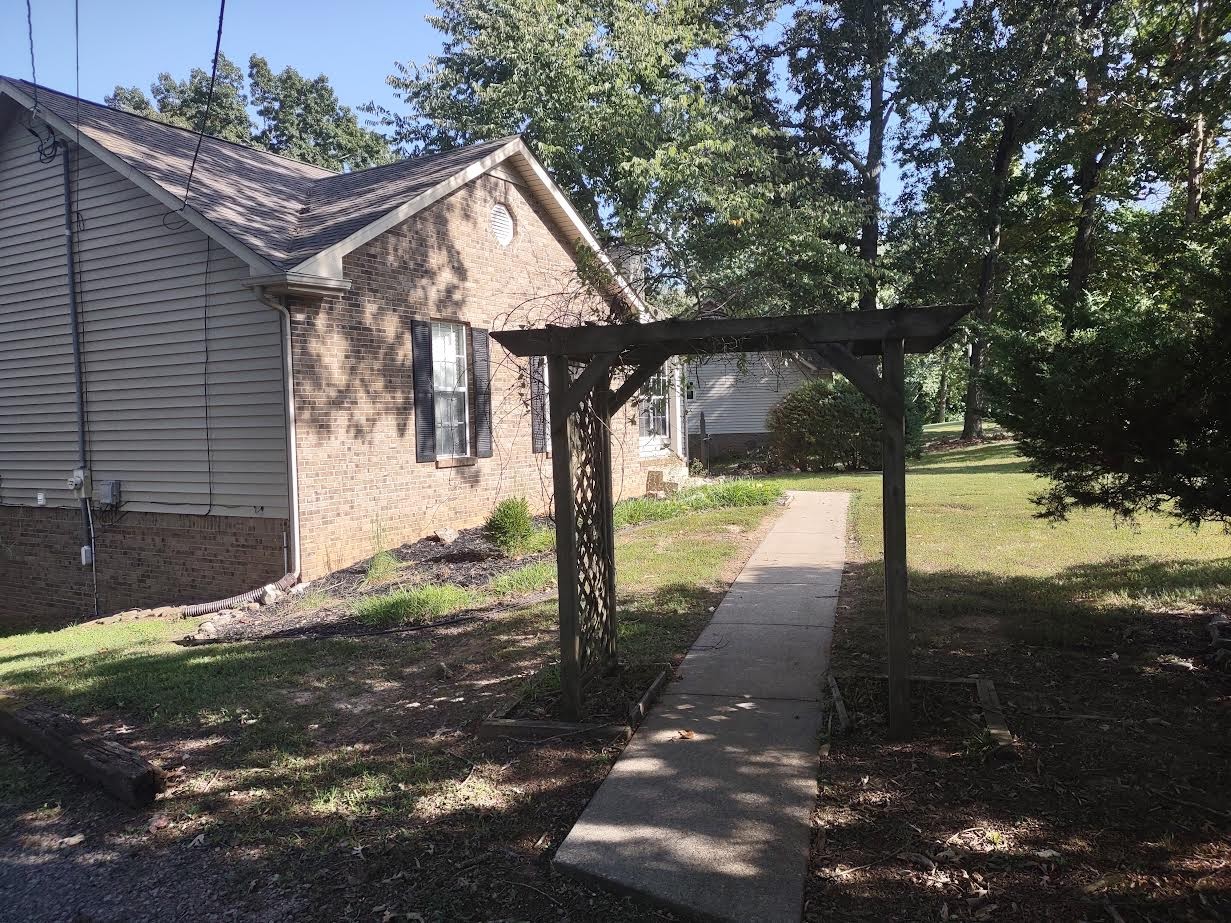 3300 Backridge Road Woodlawn, TN 37191 - Photo 3 of 42 a front view of a house with a yard