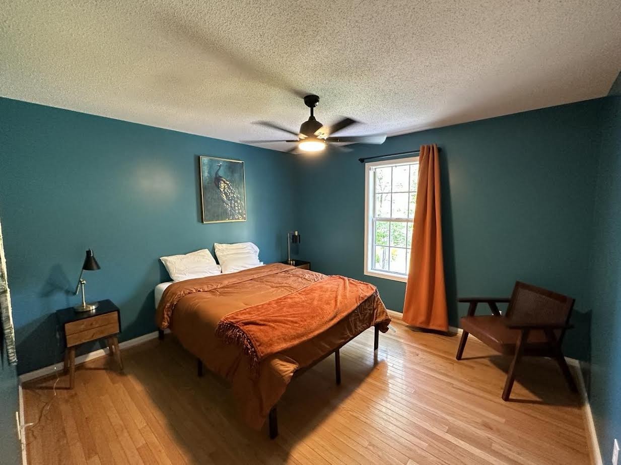 3300 Backridge Road Woodlawn, TN 37191 - Photo 39 of 42 a bed room with a bed and a chair