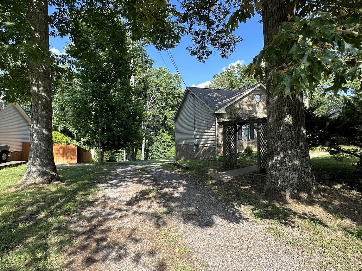 3300 Backridge Road Woodlawn, TN 37191 - Photo 4 of 42 a view of a house with a tree