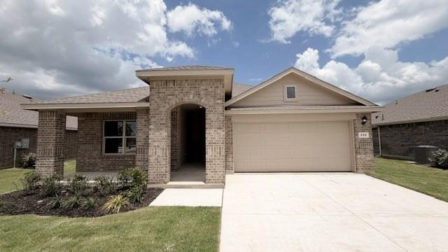 232 Blanco Drive Azle, TX 76020 - Photo 8 of 11 a front view of a house with garden