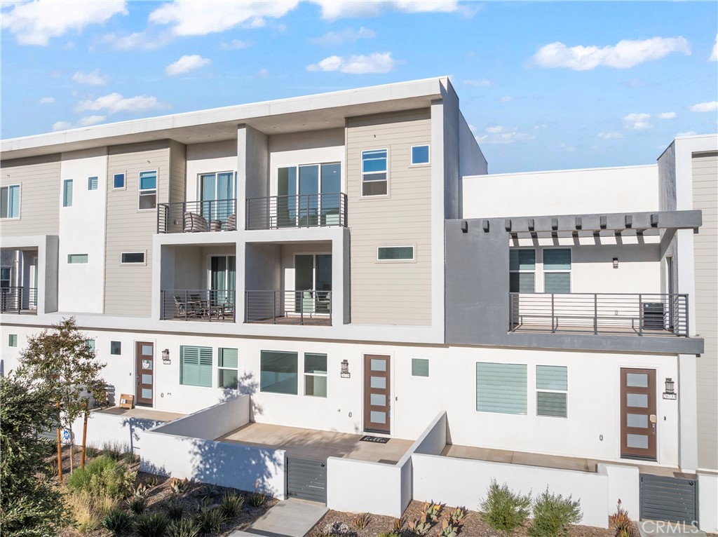 a front view of a building with a lot of windows