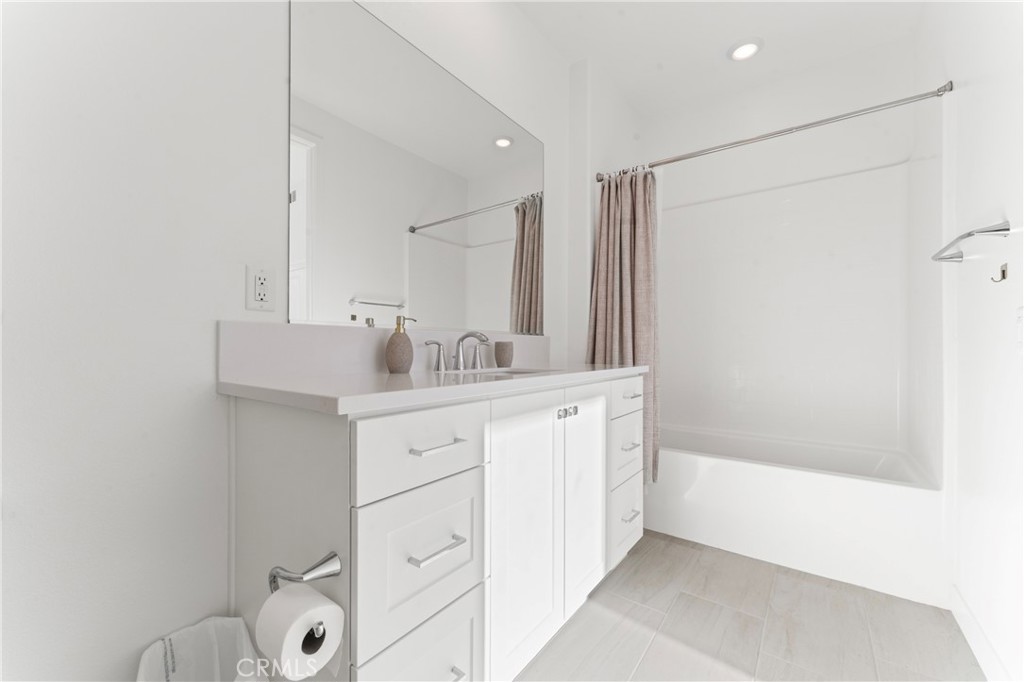 26729 Laurel Mountain Loop Valencia, CA 91381 - Photo 20 of 33 a bathroom with a sink and a mirror