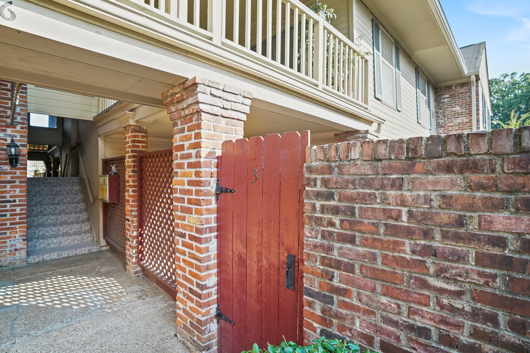 1246 Lynnfield Road, Unit 3 Memphis, TN 38119 - Photo 3 of 21 Private gate entrance opens into your own yard, patio, and covered patio space as you approach the front door. Mail is delivered to your box to the left of the gate under the covered breezeway.