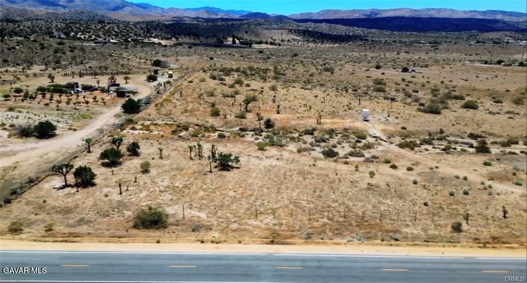 11250 Fort Tejon Road East Littlerock, CA 93543 - Photo 5 of 6 a view of a large yard with wooden floor and fence