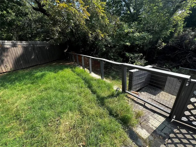a view of a backyard with sitting area