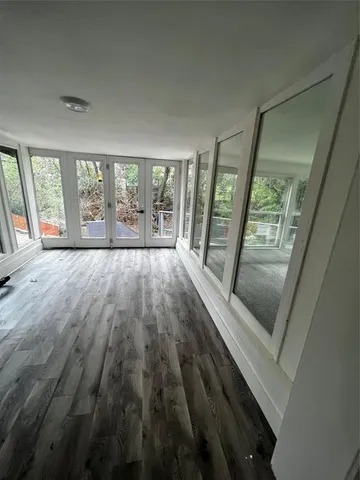 a large kitchen with kitchen island granite countertop a large counter top stainless steel appliances and cabinets