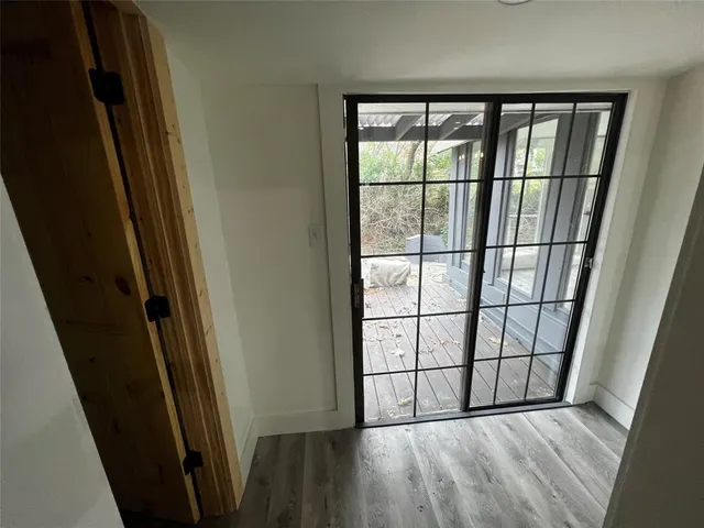a kitchen with granite countertop a stove a sink and a refrigerator