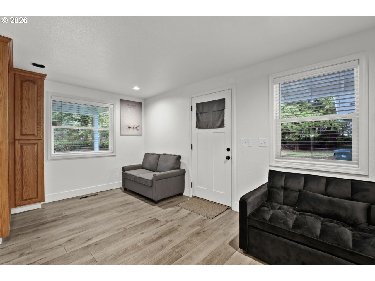 4847 Darlings Loop Florence, OR 97439 - Photo 22 of 47 a living room with furniture and a large window