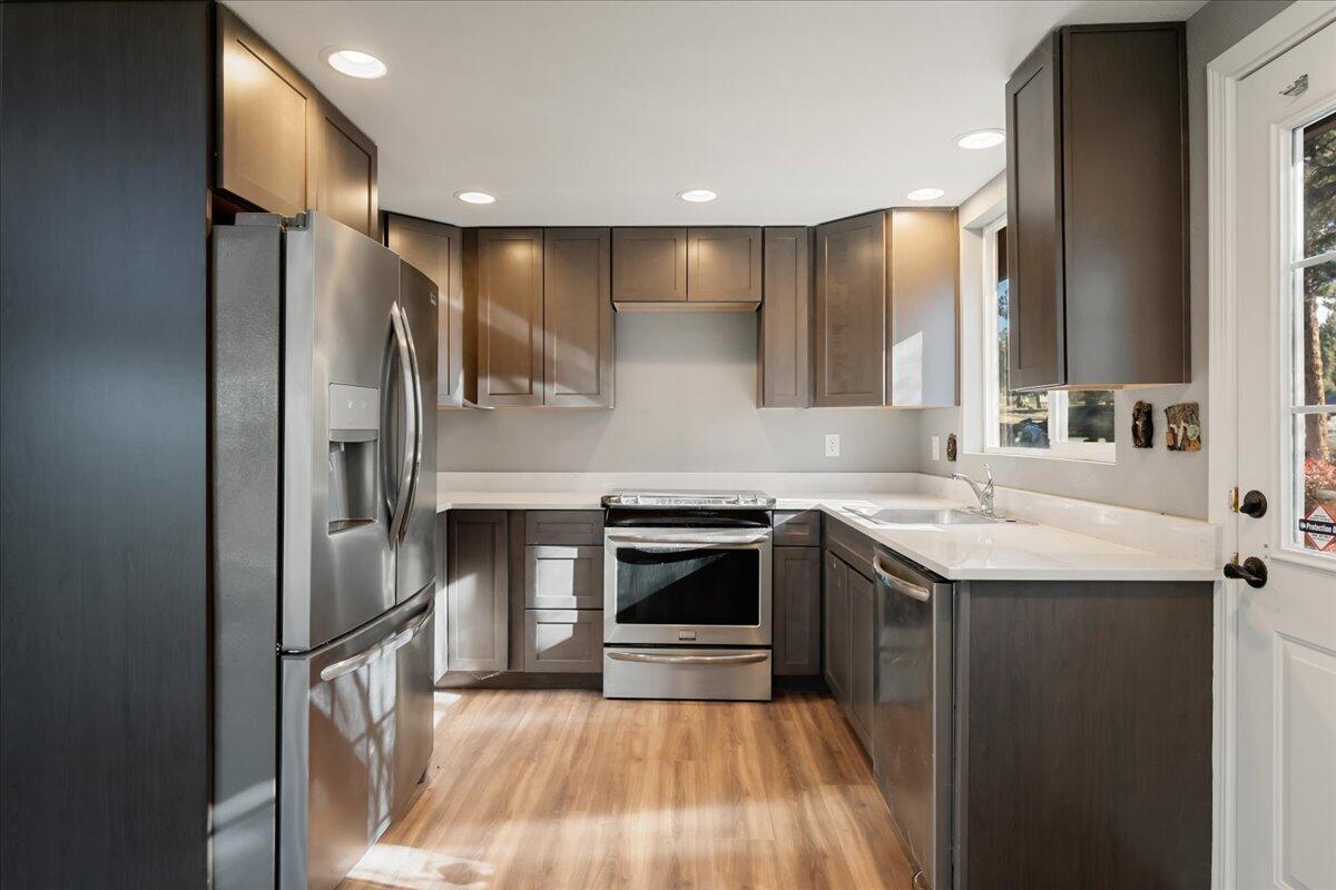 5504 Lake Shastina Drive Weed, CA 96094 - Photo 6 of 31 a kitchen with a sink stove and refrigerator