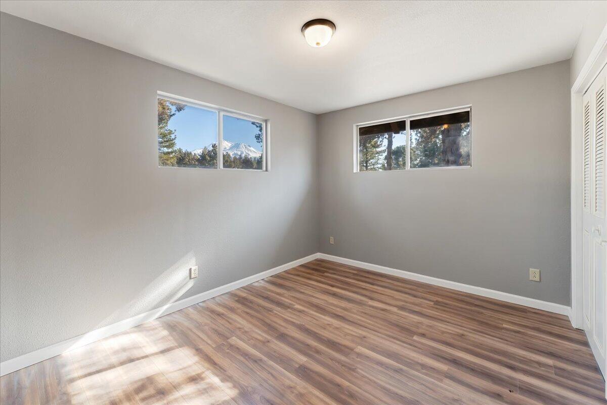 5504 Lake Shastina Drive Weed, CA 96094 - Photo 10 of 31 a view of a room with wooden floor and window