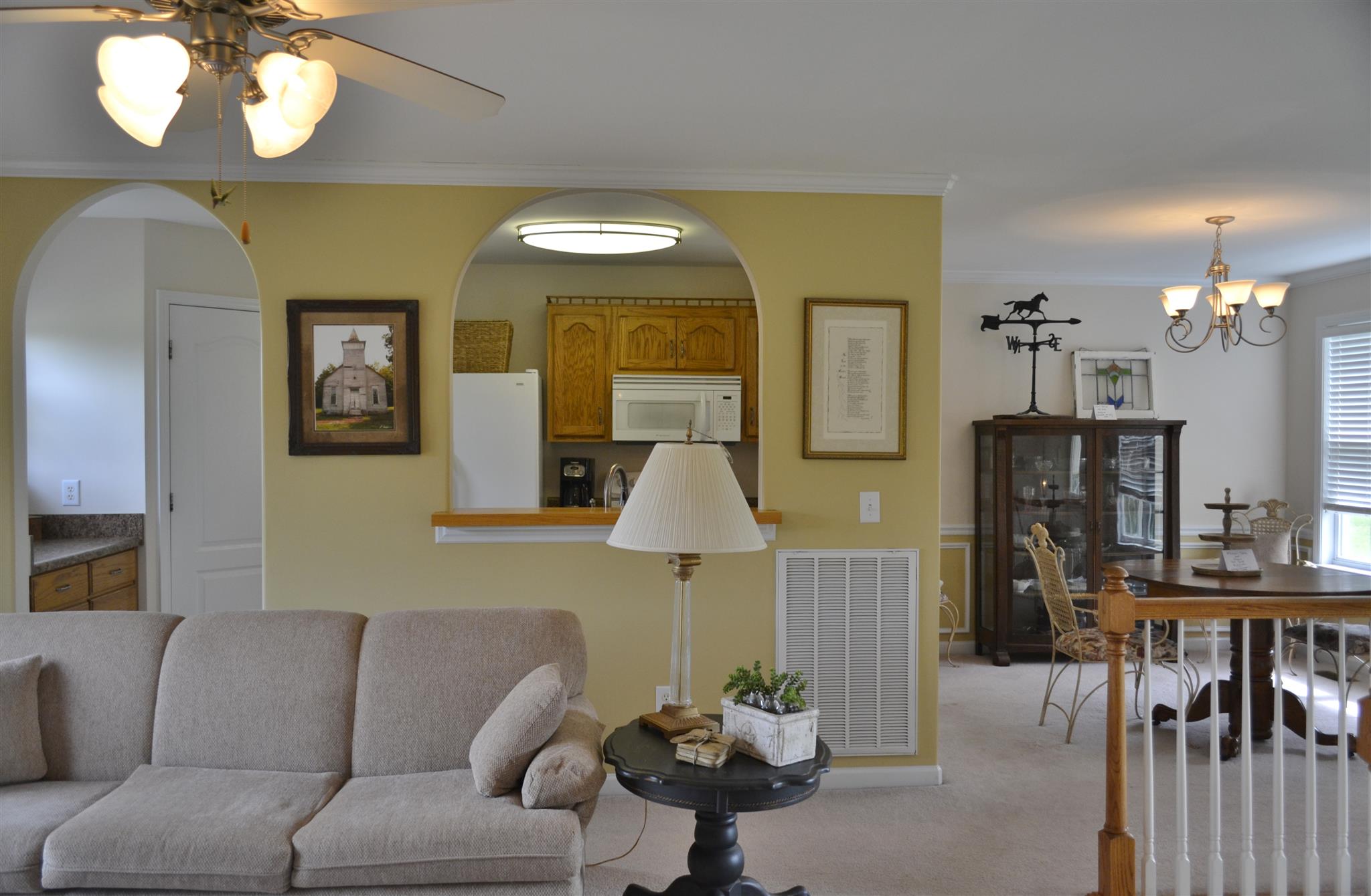 1905 Clara Mathis Road Spring Hill, TN 37174 - Photo 12 of 29 a living room with furniture chandelier and a mirror