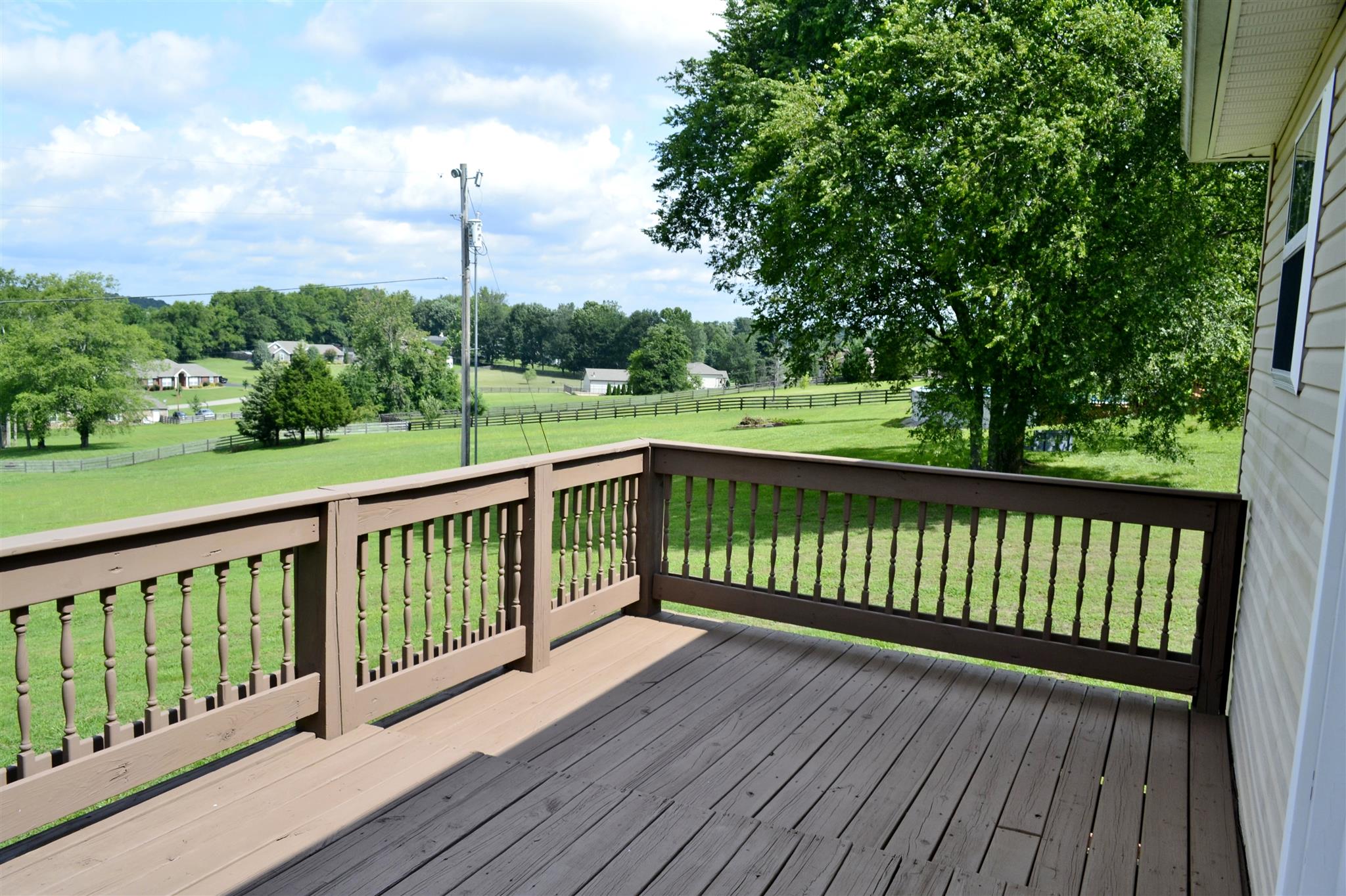1905 Clara Mathis Road Spring Hill, TN 37174 - Photo 14 of 29 a view of a balcony with wooden floor & fence