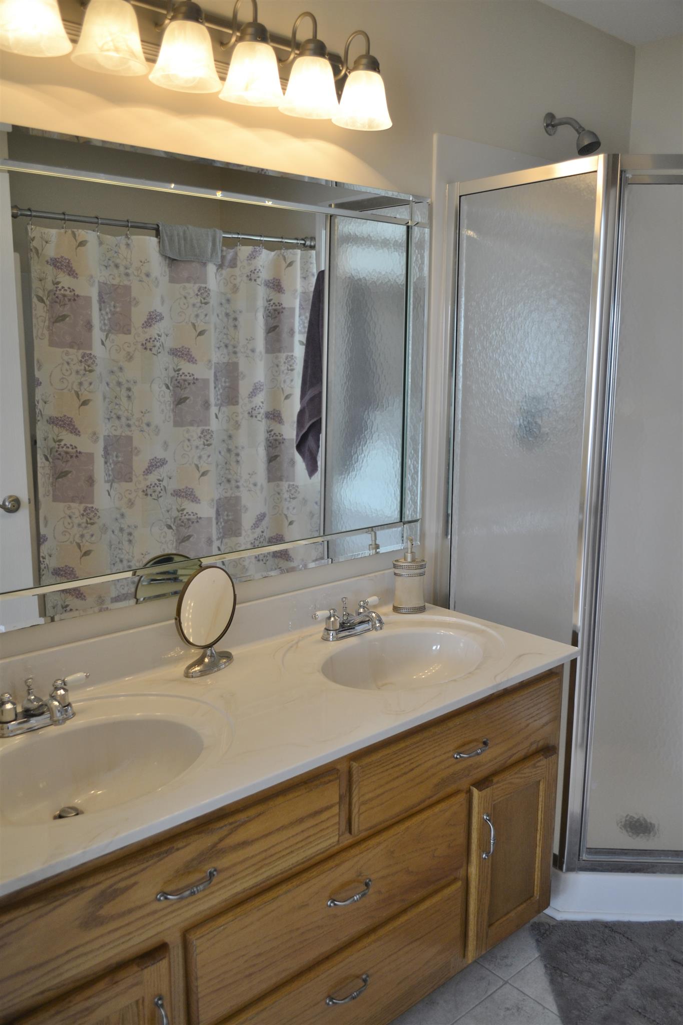 1905 Clara Mathis Road Spring Hill, TN 37174 - Photo 18 of 29 a bathroom with a sink and mirror