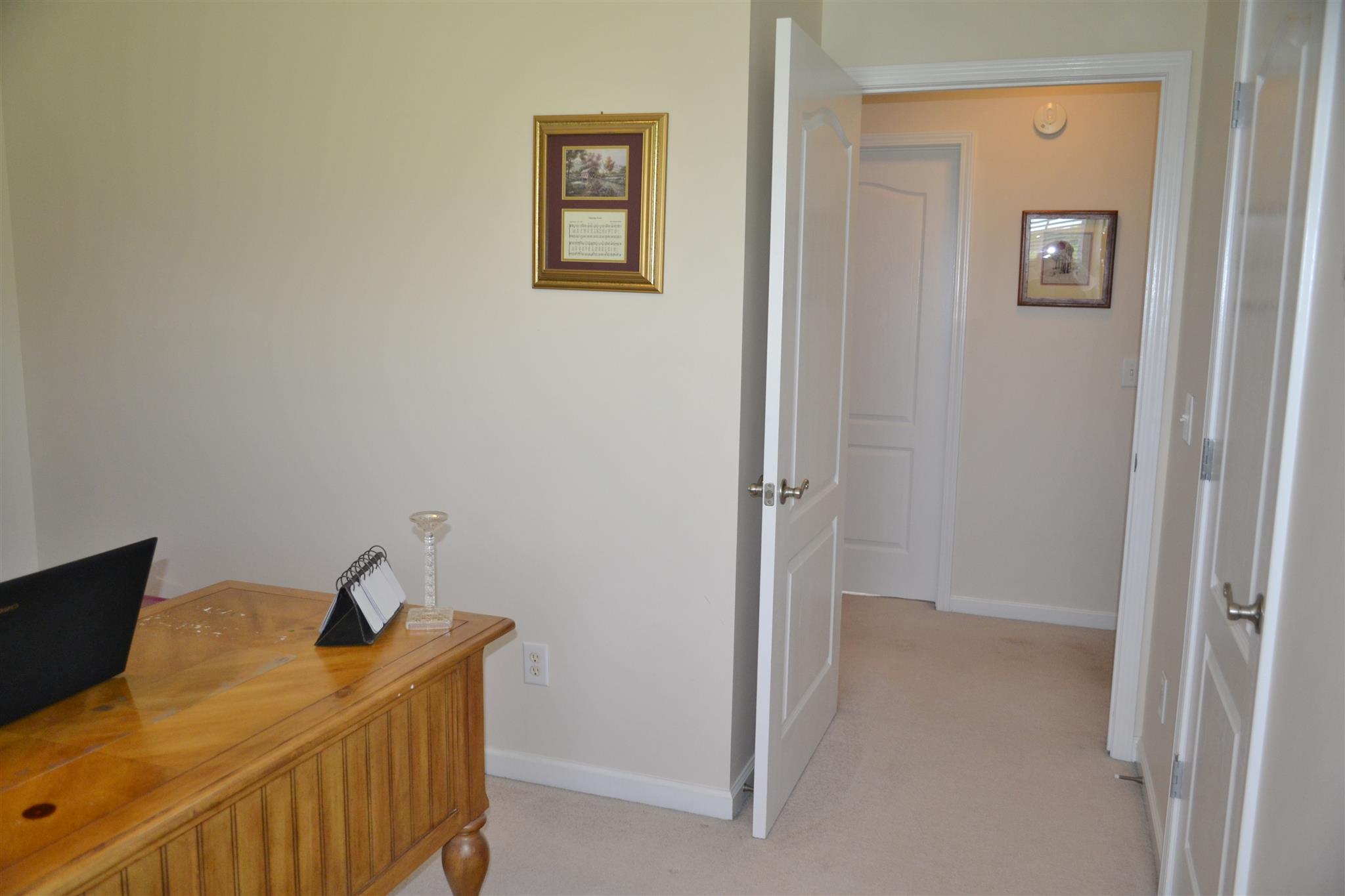 1905 Clara Mathis Road Spring Hill, TN 37174 - Photo 21 of 29 a bedroom with a bed and wooden floor