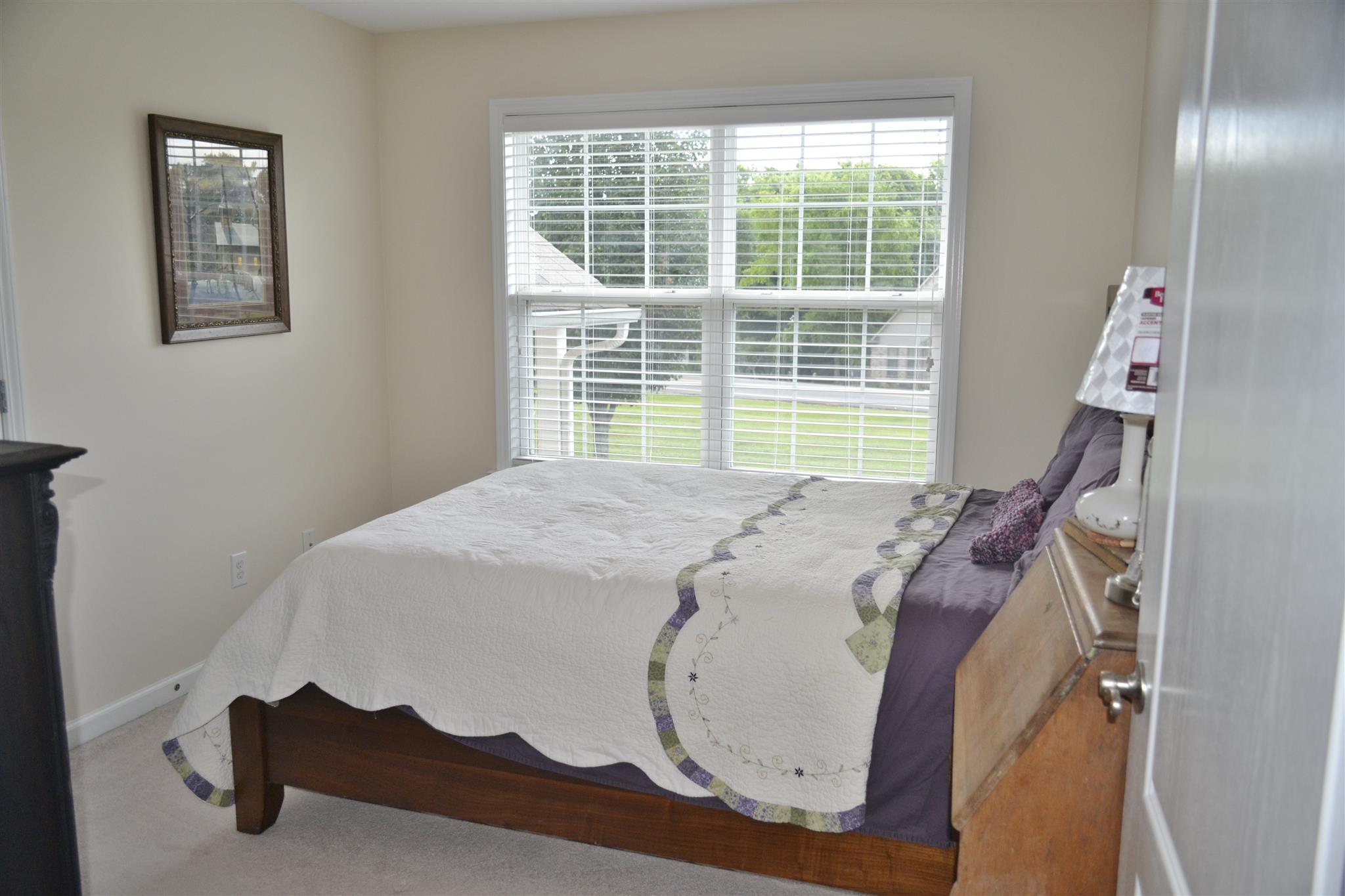 1905 Clara Mathis Road Spring Hill, TN 37174 - Photo 22 of 29 a bed sitting in a bedroom next to a window