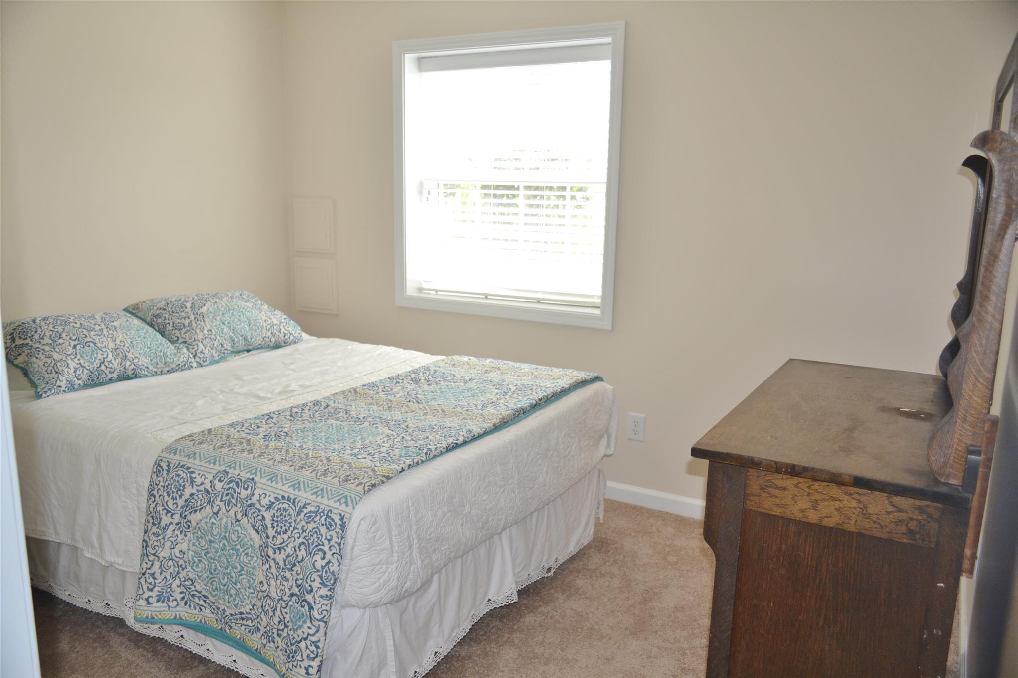 1905 Clara Mathis Road Spring Hill, TN 37174 - Photo 23 of 29 a bedroom with a bed and a window