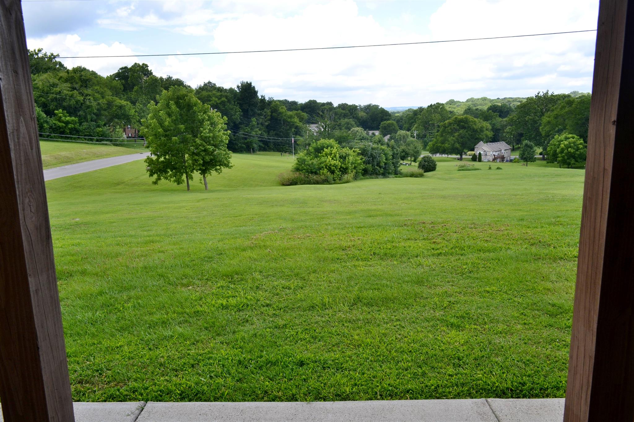1905 Clara Mathis Road Spring Hill, TN 37174 - Photo 29 of 29 a view of a field with a tree in the background
