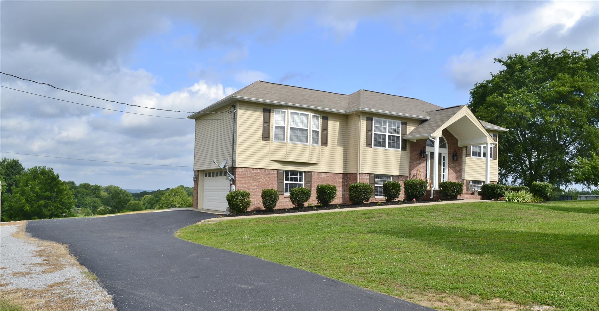 1905 Clara Mathis Road Spring Hill, TN 37174 - Photo 3 of 29 a front view of a house with a yard