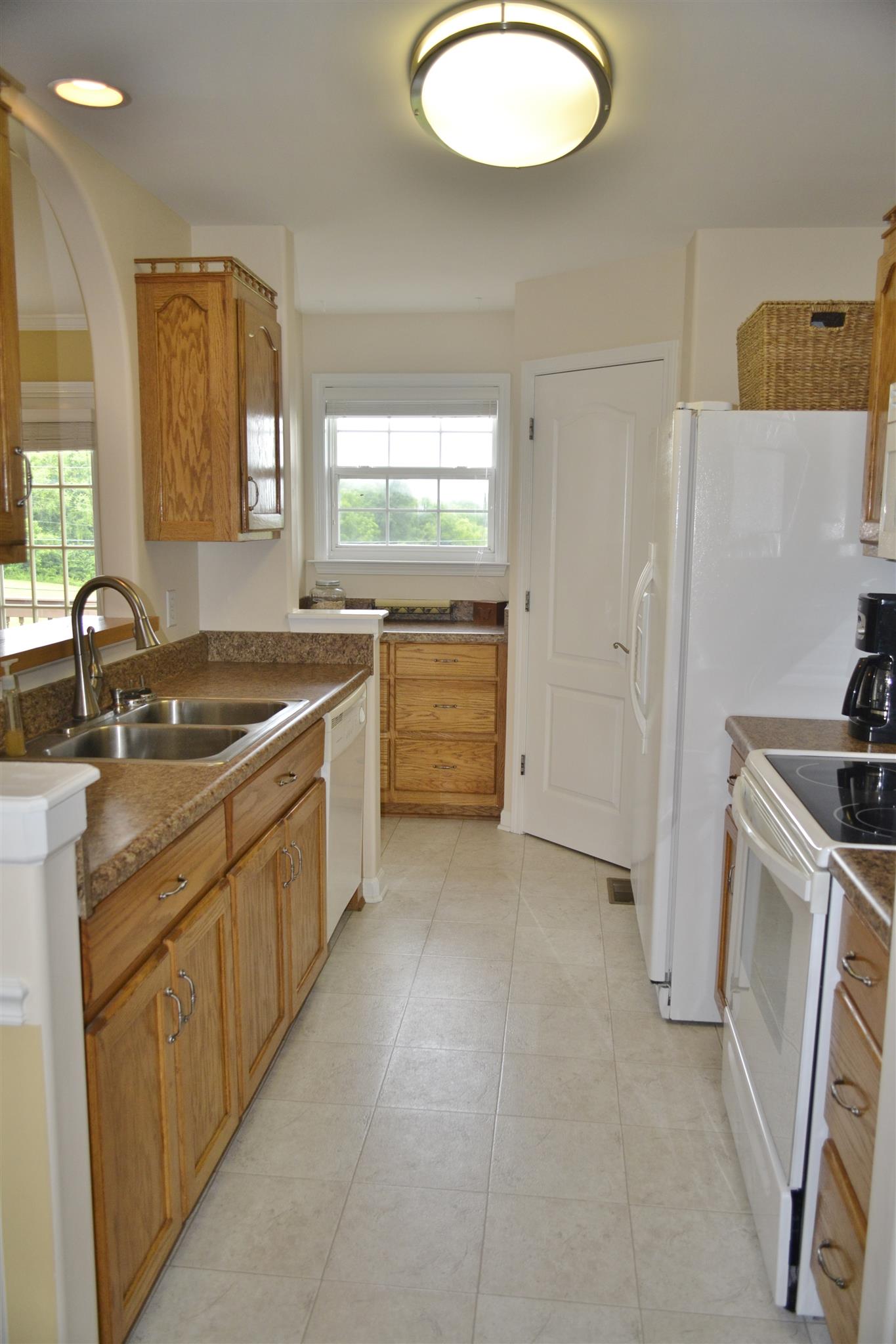 1905 Clara Mathis Road Spring Hill, TN 37174 - Photo 7 of 29 a kitchen with a sink stove and refrigerator