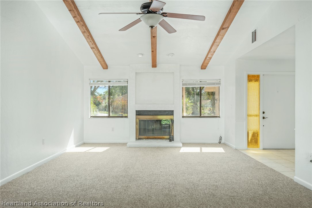 332 Oak Circle Sebring, FL 33876 - Photo 2 of 16 a view of empty room with a fireplace