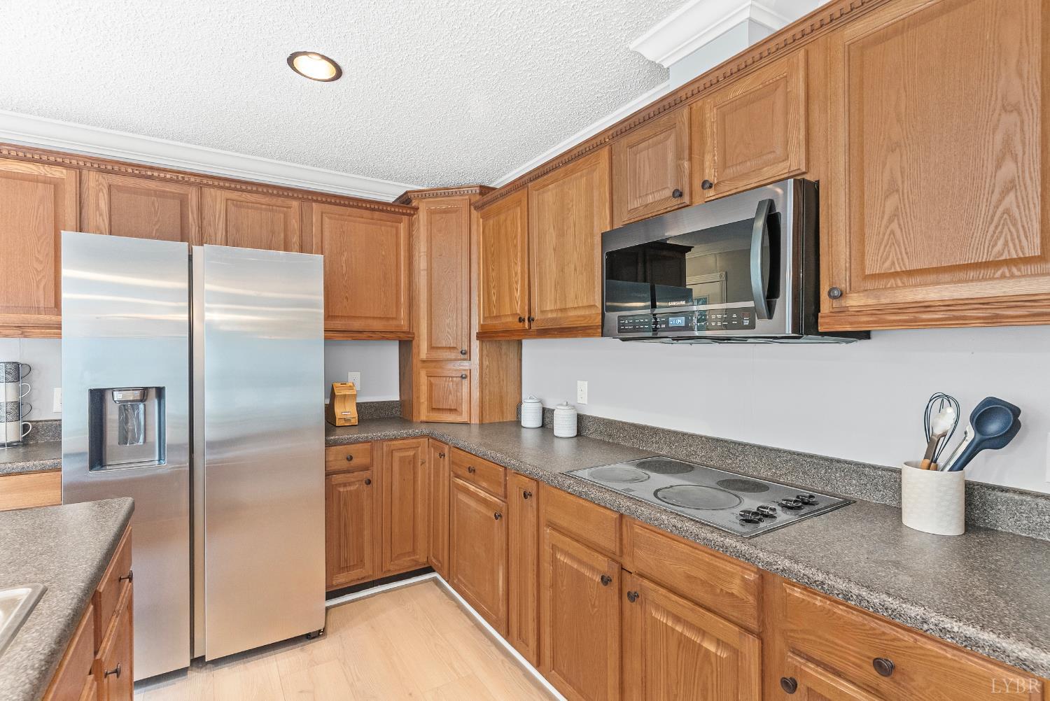 3701 Bethany Road Rustburg, VA 24588 - Photo 35 of 55 a kitchen with stainless steel appliances granite countertop a refrigerator a stove a sink and dishwasher