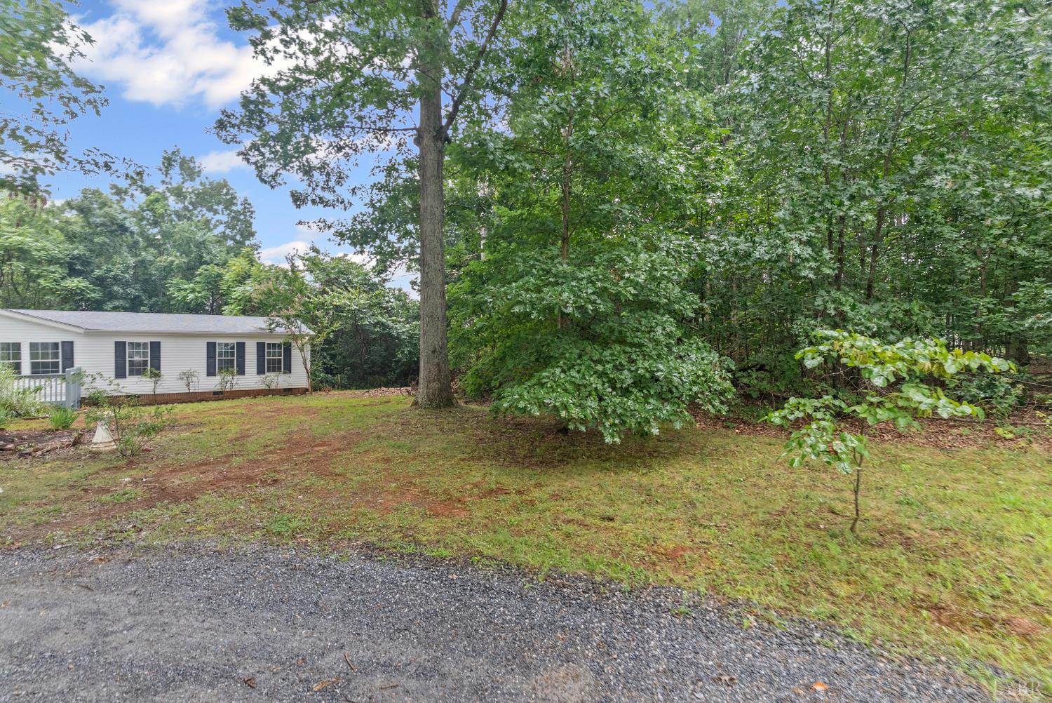 3701 Bethany Road Rustburg, VA 24588 - Photo 41 of 55 a front view of a house with a garden
