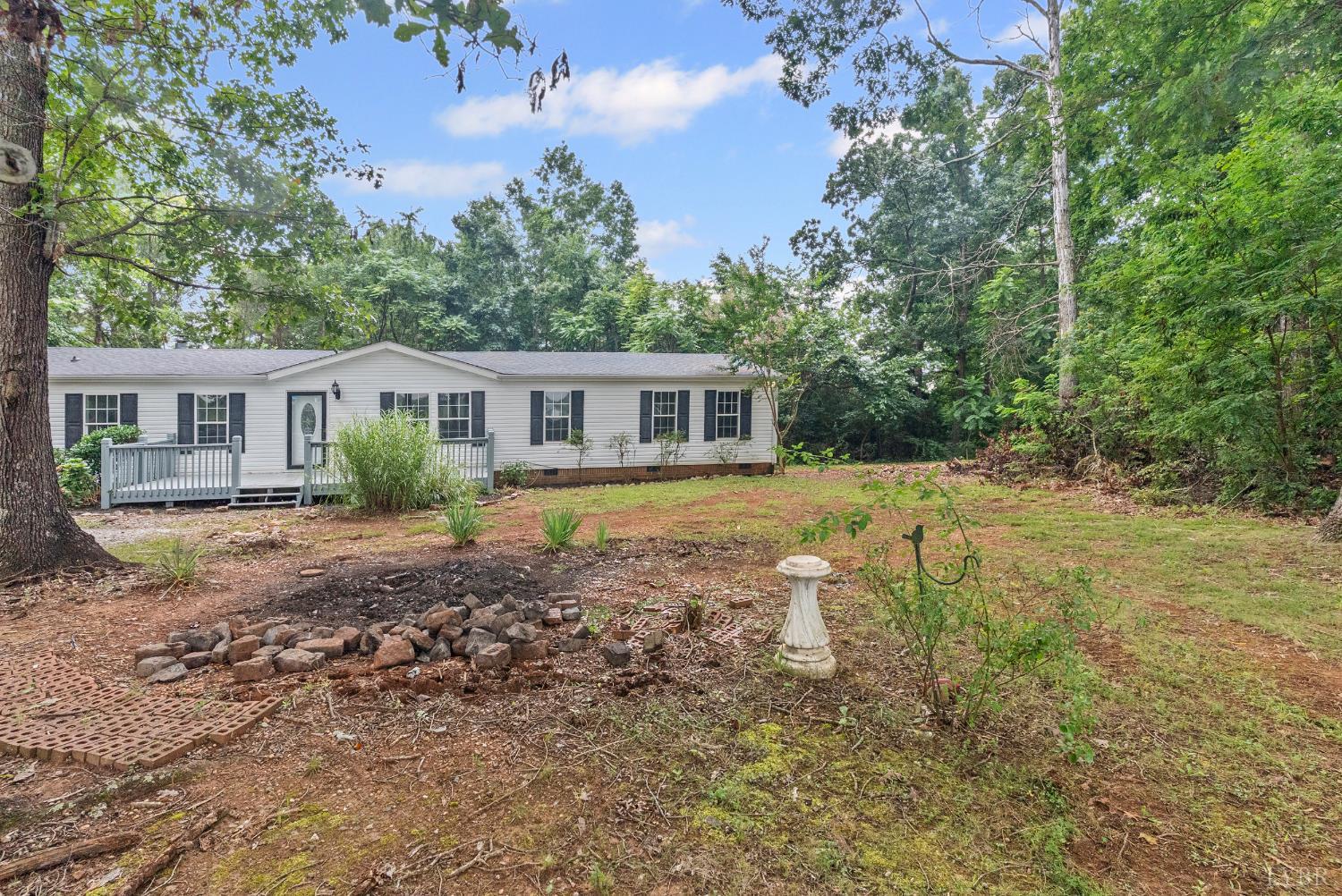 3701 Bethany Road Rustburg, VA 24588 - Photo 42 of 55 a view of house with yard and sitting area