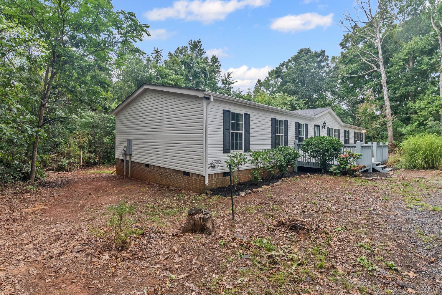 3701 Bethany Road Rustburg, VA 24588 - Photo 43 of 55 a view of a house with a yard and large trees