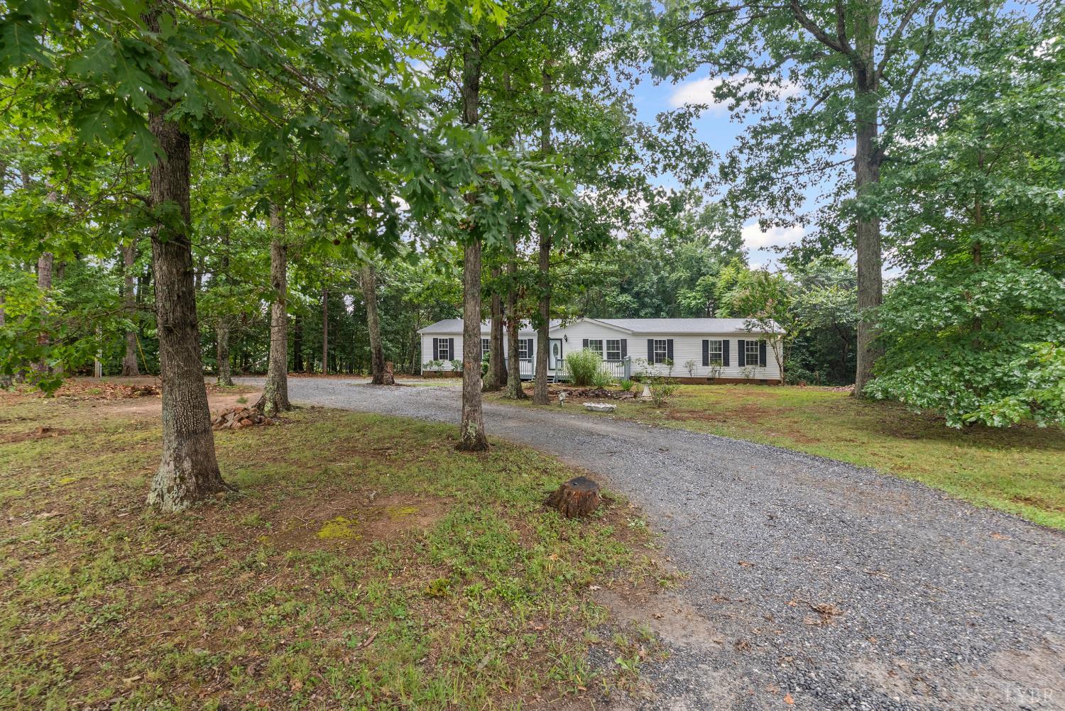 3701 Bethany Road Rustburg, VA 24588 - Photo 50 of 55 a house with trees in the background