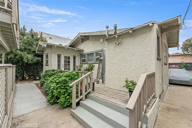 a view of a house with wooden fence