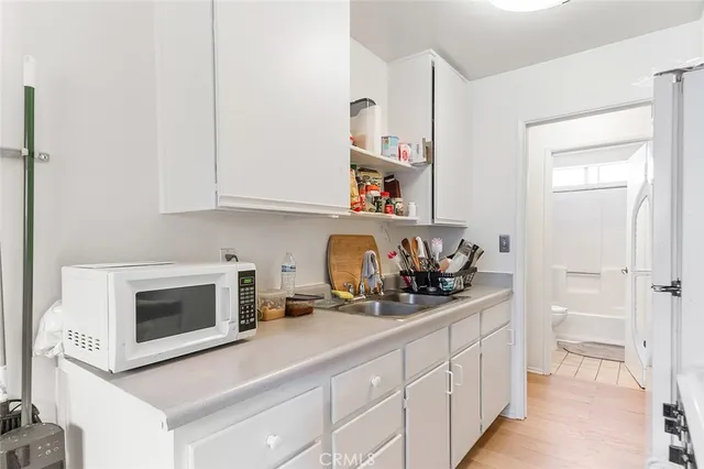 a kitchen with stainless steel appliances granite countertop a sink and a cabinets
