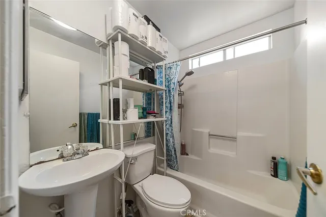 a bed sitting in a room next to a small yard