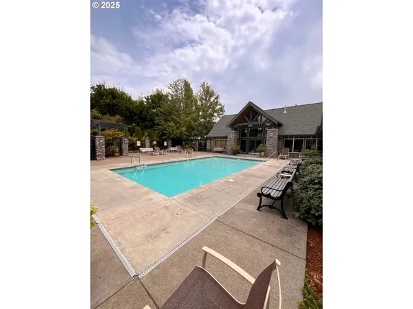 a view of a backyard with sitting area