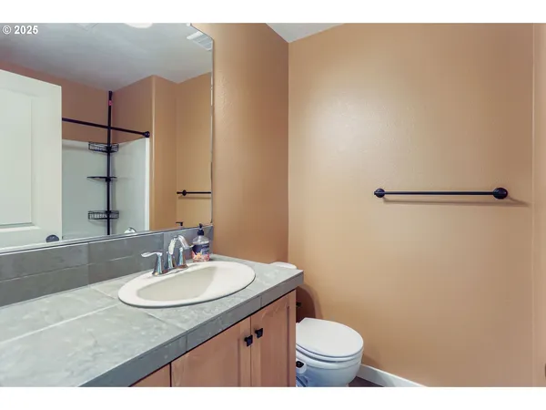 a view of a bathroom with a sink and a mirror