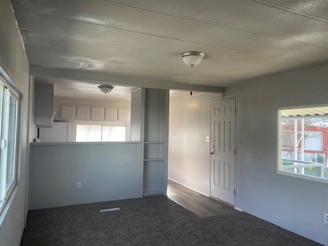 14610 Mono Way, Unit 7 Sonora, CA 95370 - Photo 6 of 15 Spare room with dark colored carpet