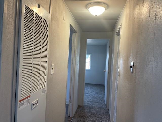 14610 Mono Way, Unit 7 Sonora, CA 95370 - Photo 10 of 15 Corridor featuring a heating unit and dark carpet