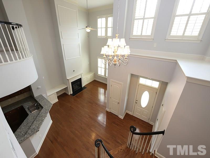 832 Historian Street Raleigh, NC 27603 - Photo 16 of 25 a view of a livingroom with furniture wooden floor and a fireplace