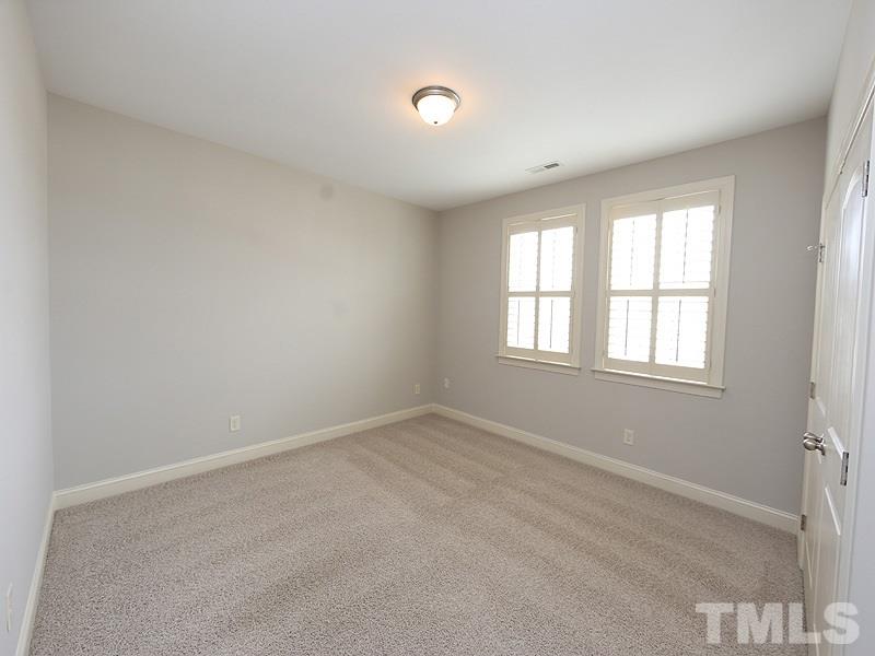 832 Historian Street Raleigh, NC 27603 - Photo 19 of 25 an empty room with windows
