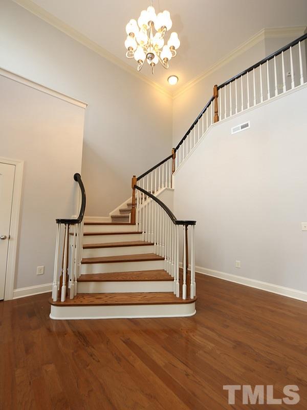 832 Historian Street Raleigh, NC 27603 - Photo 4 of 25 a view of entryway with wooden floor