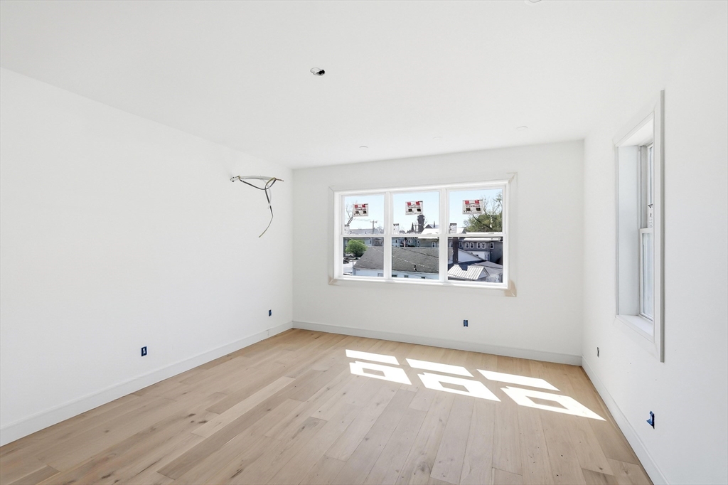 7 Elizabeth Lane, Unit 7 Paxton, MA 01612 - Photo 14 of 30 a view of empty room with wooden floor and fan